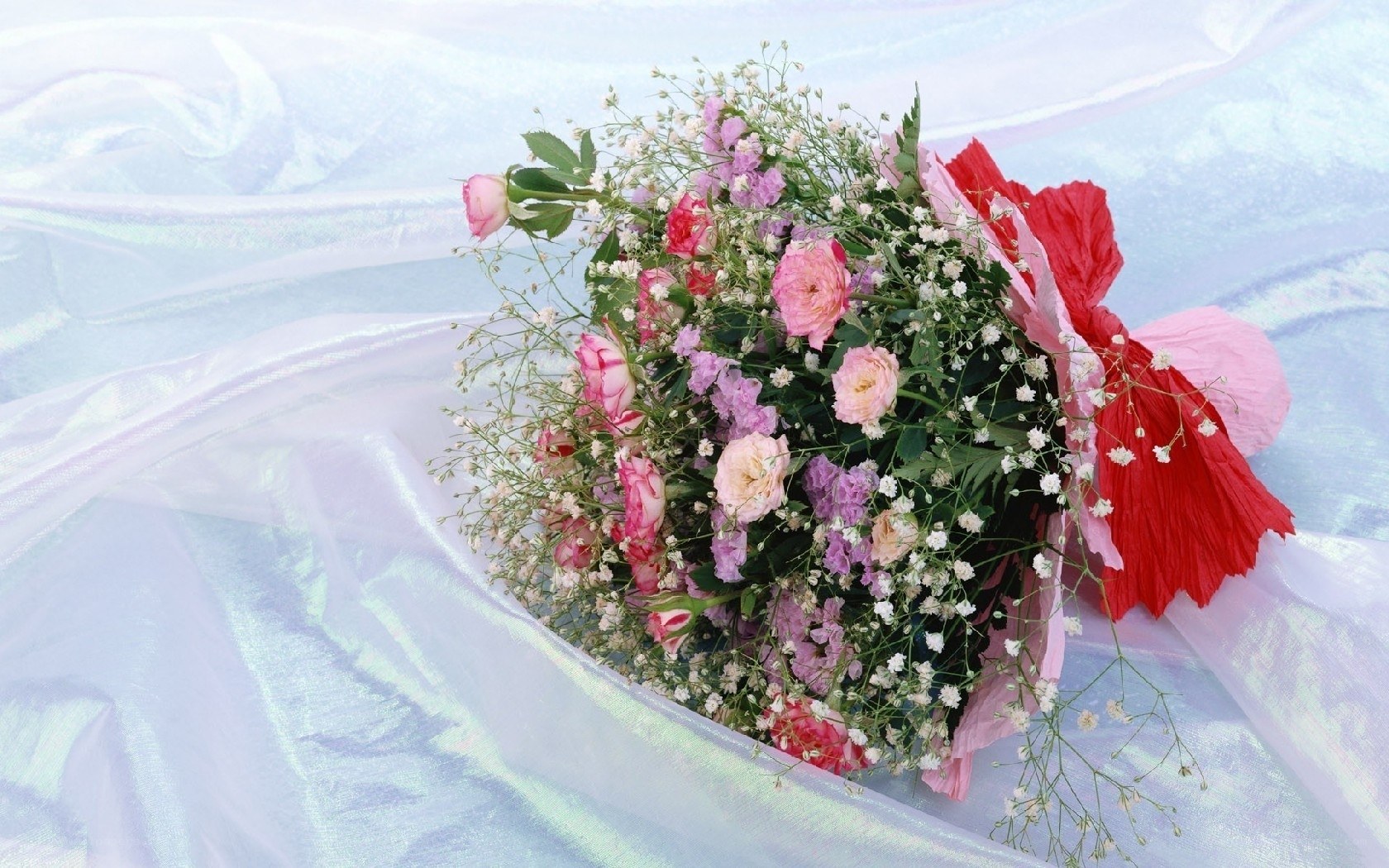 Floral bouquet with red ribbon