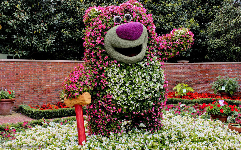 Floral character sculpture in garden