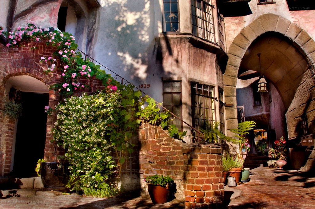 Floral courtyard with stone arches