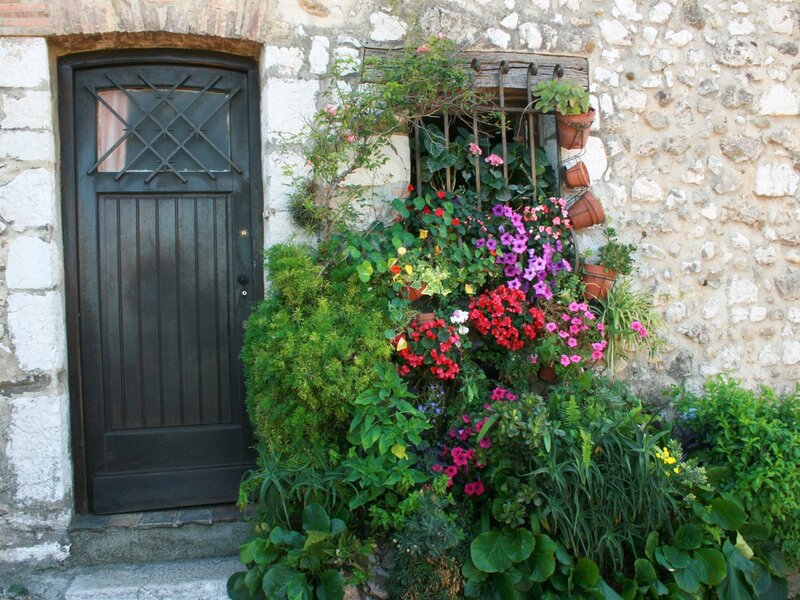 Floral garden by stone door