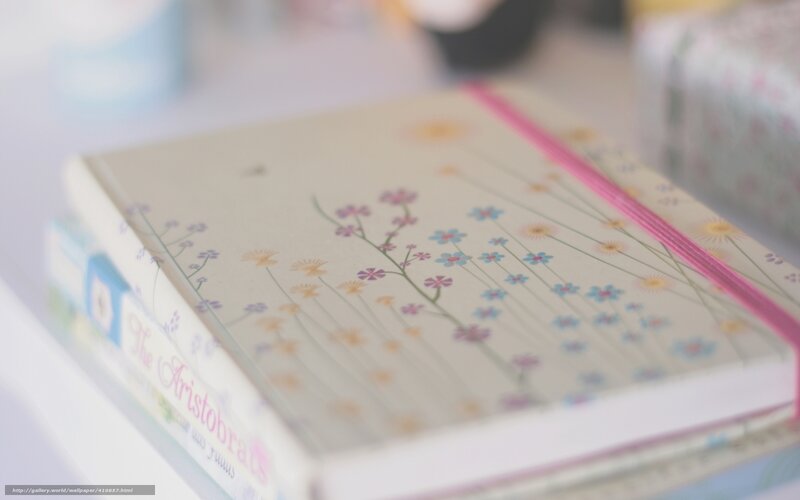 Floral notebook on a stack