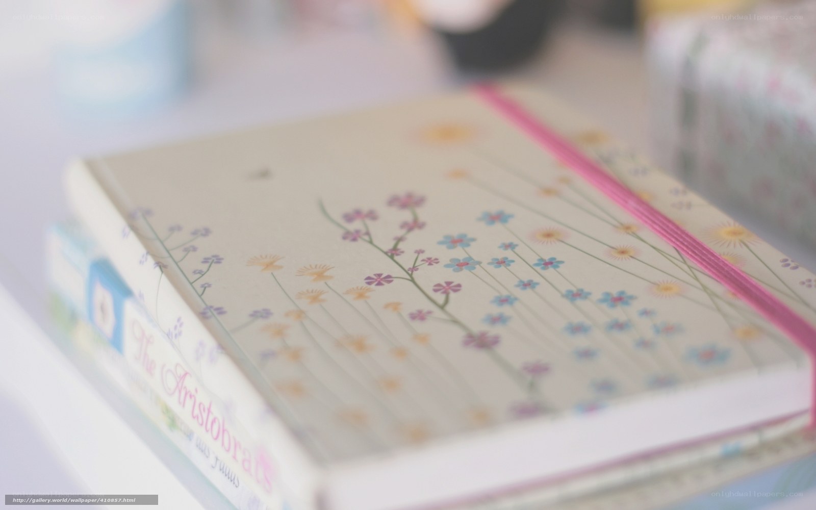 Floral notebook on a stack