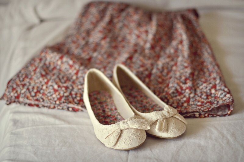floral skirt and cream shoes