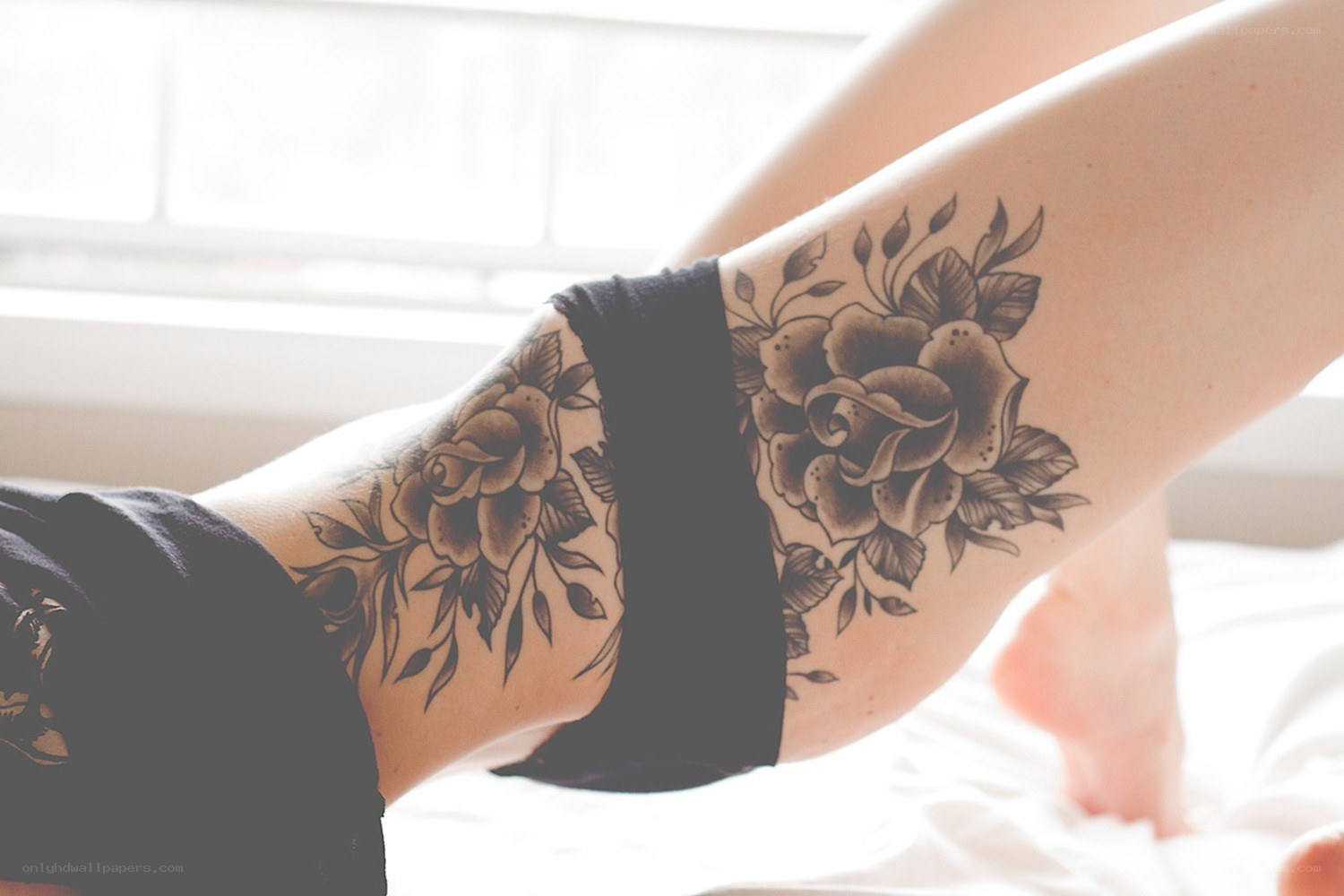 Floral tattoo on legs
