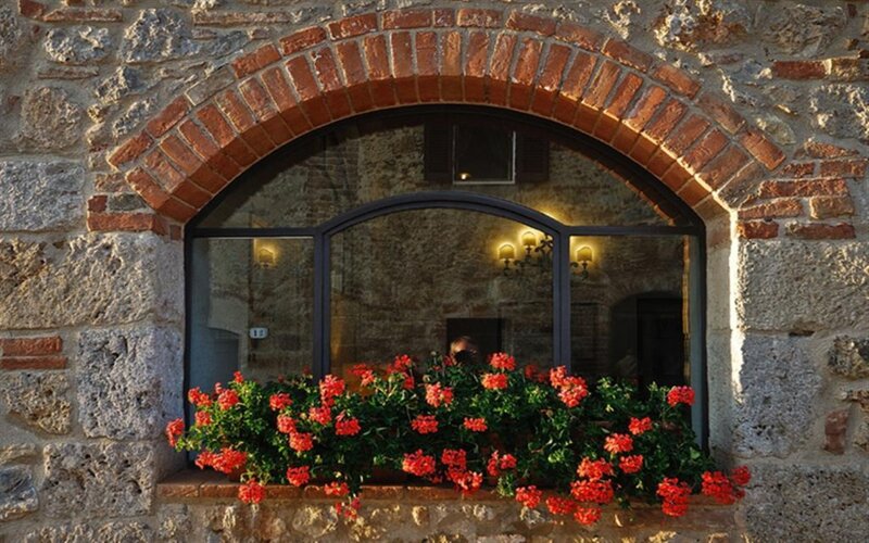 Floral window in stone building