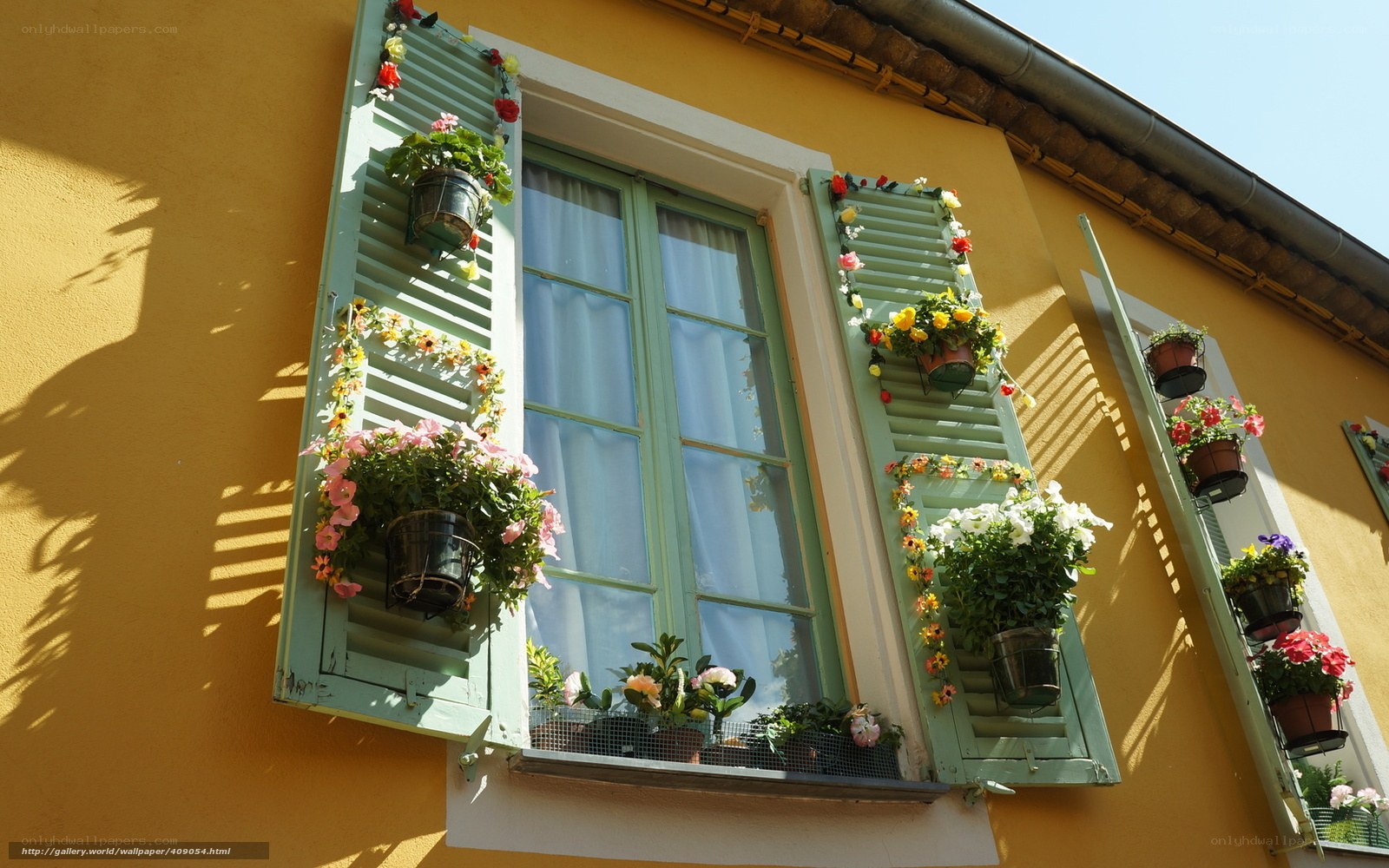 Floral window in yellow house