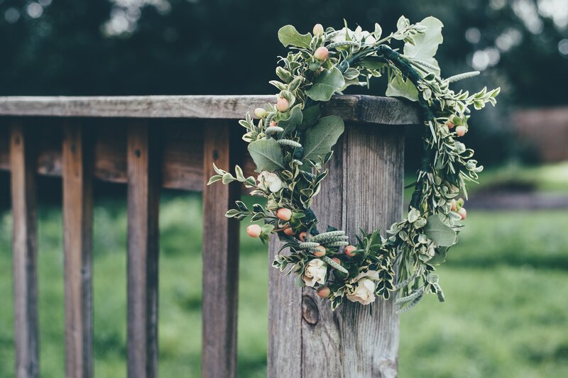 Floral wreath on wooden railing