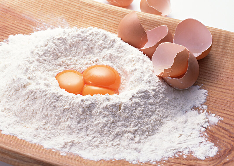 flour and eggs on wood