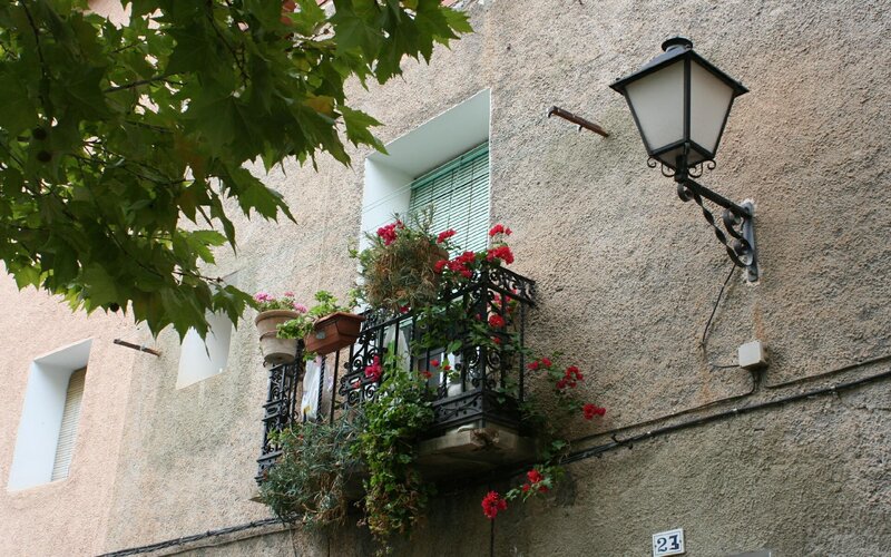 Flower-adorned balcony in a European town