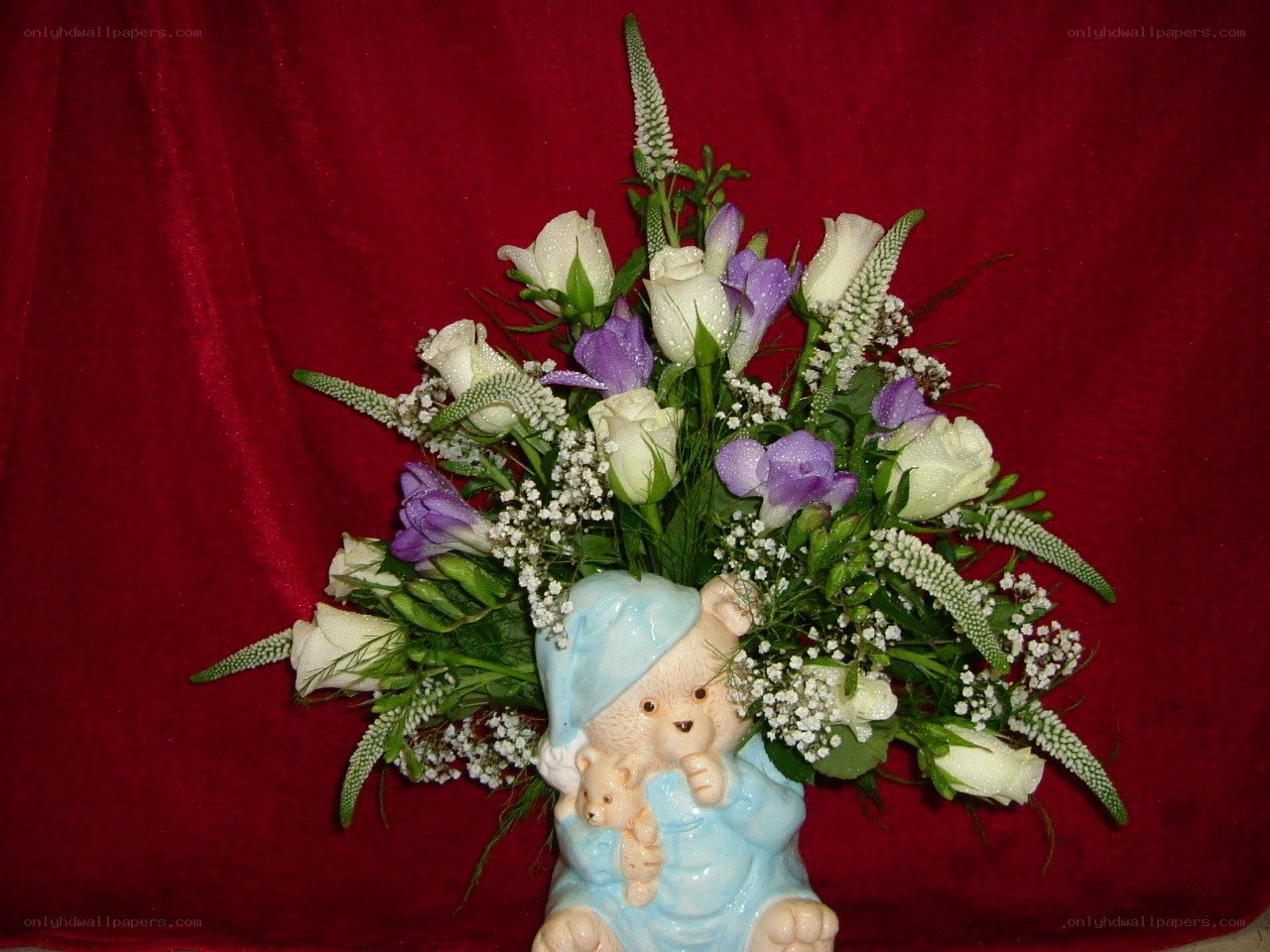 Flower arrangement with bear vase