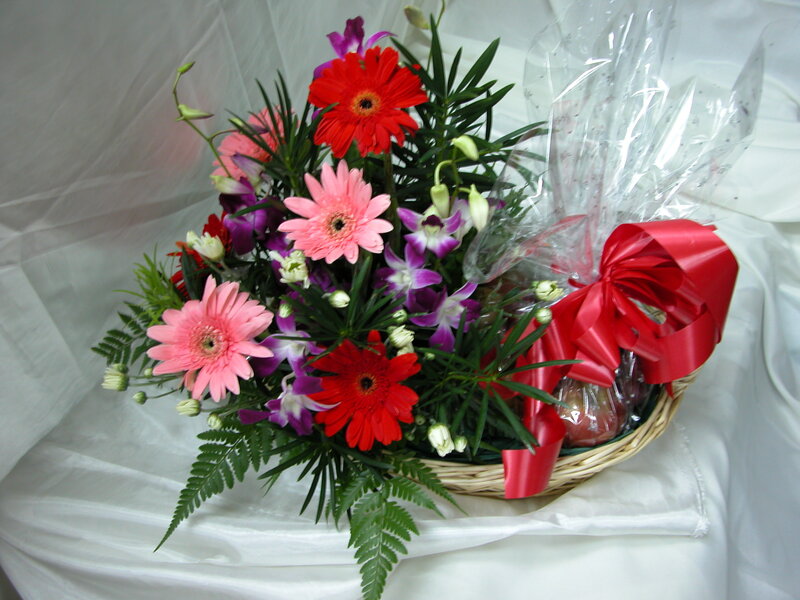 Flower basket with red ribbon