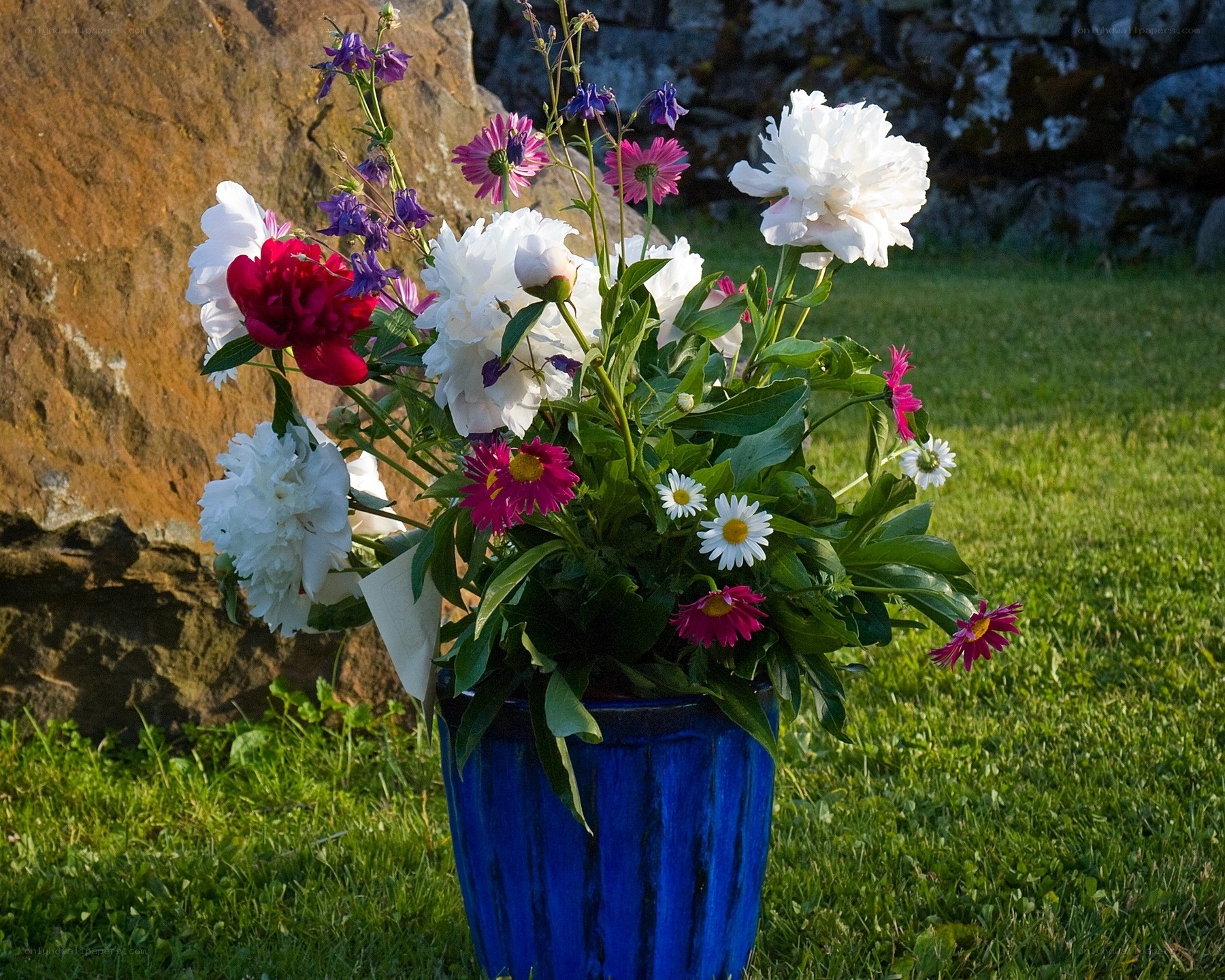 Flower bouquet in blue pot