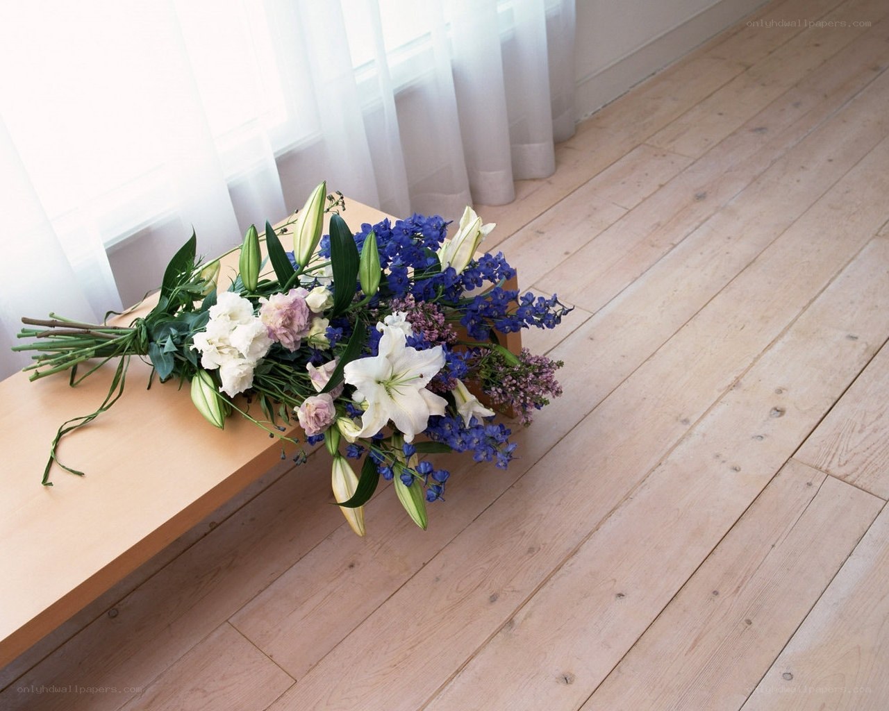 Flower bouquet on wooden bench