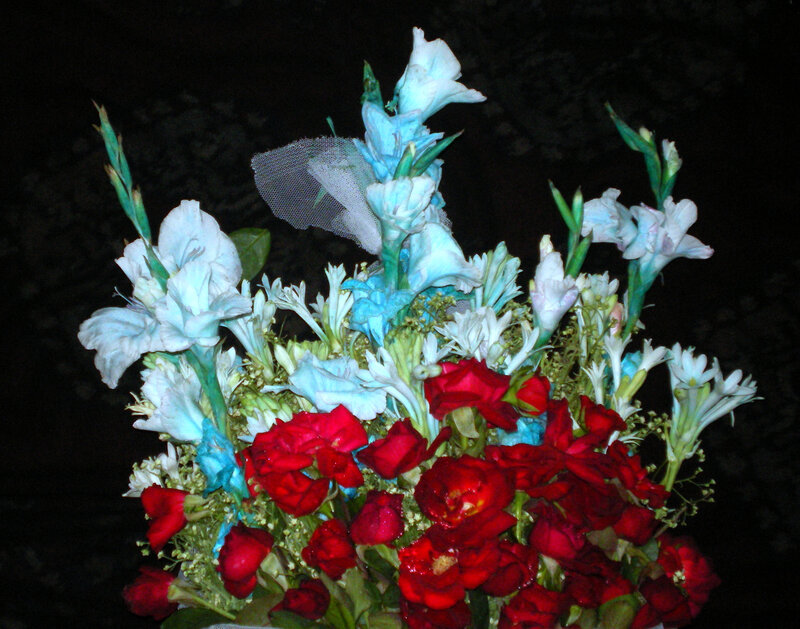 Flower bouquet with red and blue flowers