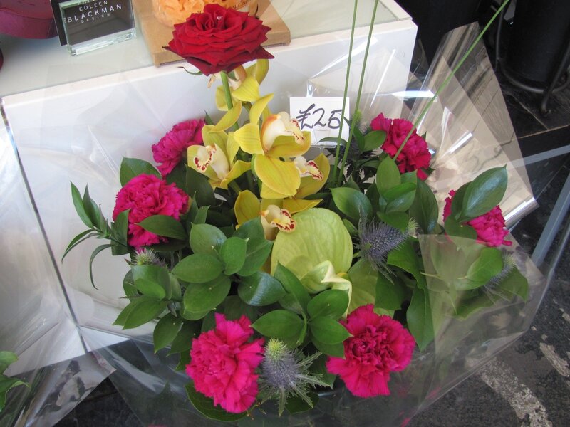 Flower bouquet with roses and orchids