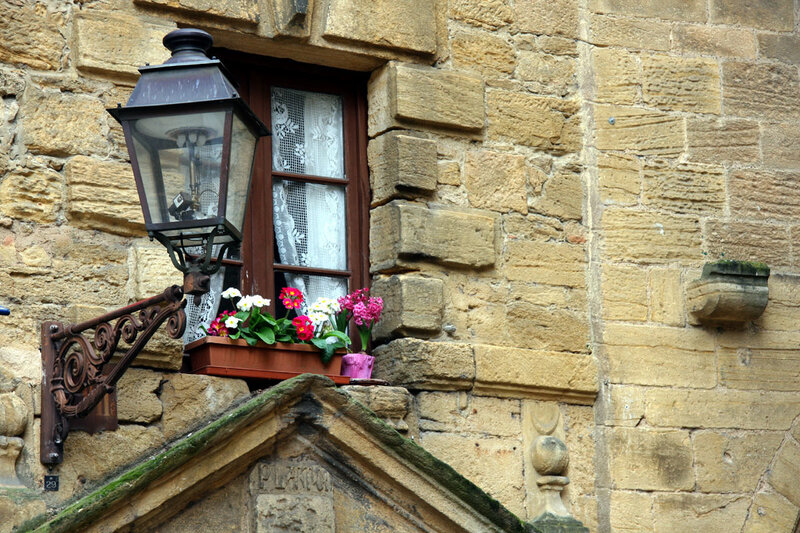 Flower box by old stone window