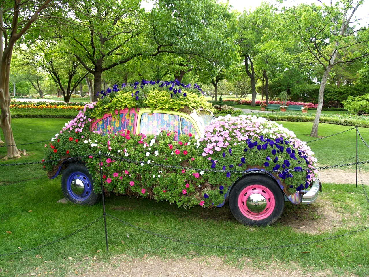 Flower-covered car sculpture