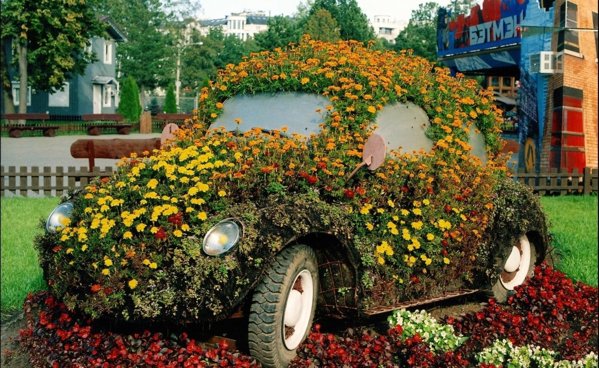 Flower-covered car sculpture