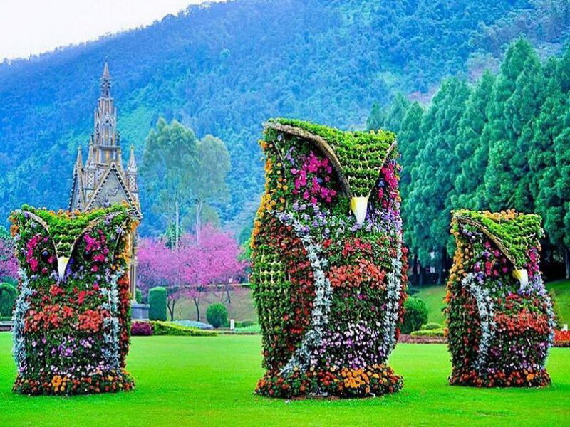 Flower-covered Owl Sculptures