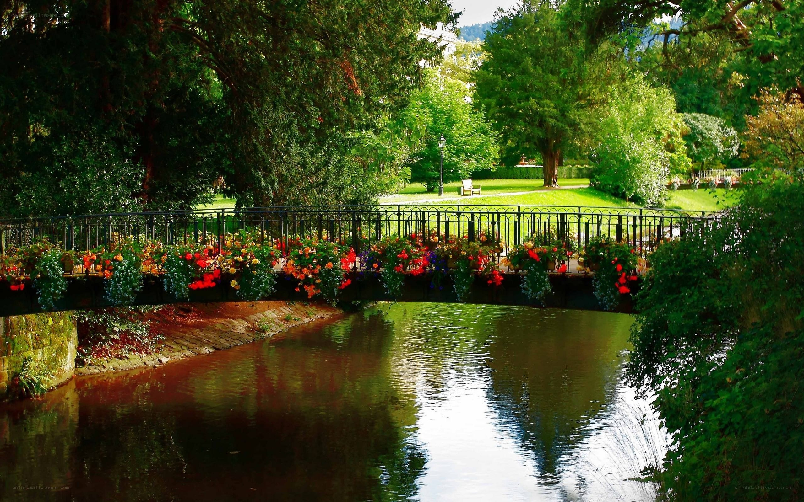 Flower-decked bridge over river