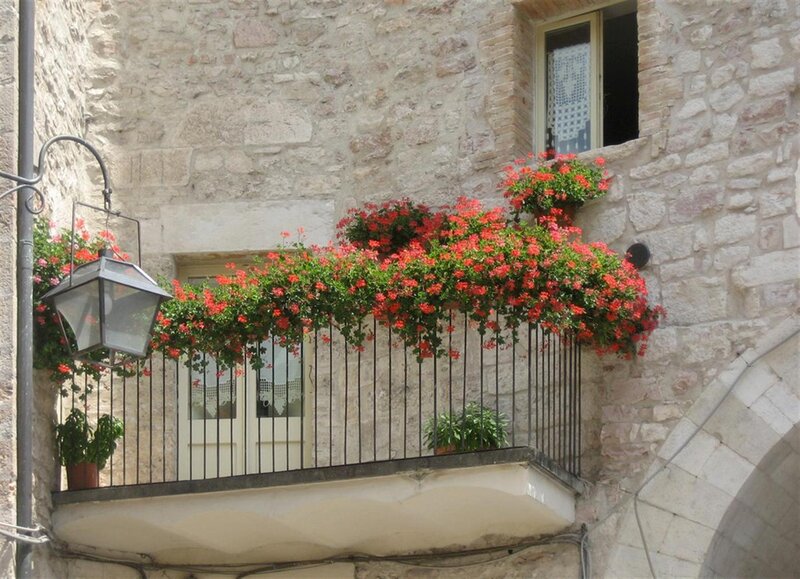 Flower-filled balcony in old town