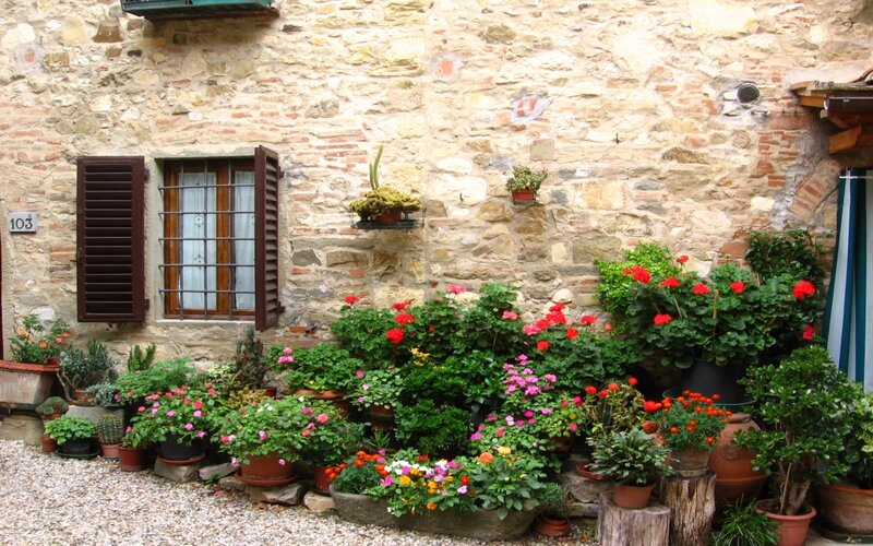 Flower-filled courtyard in Italy