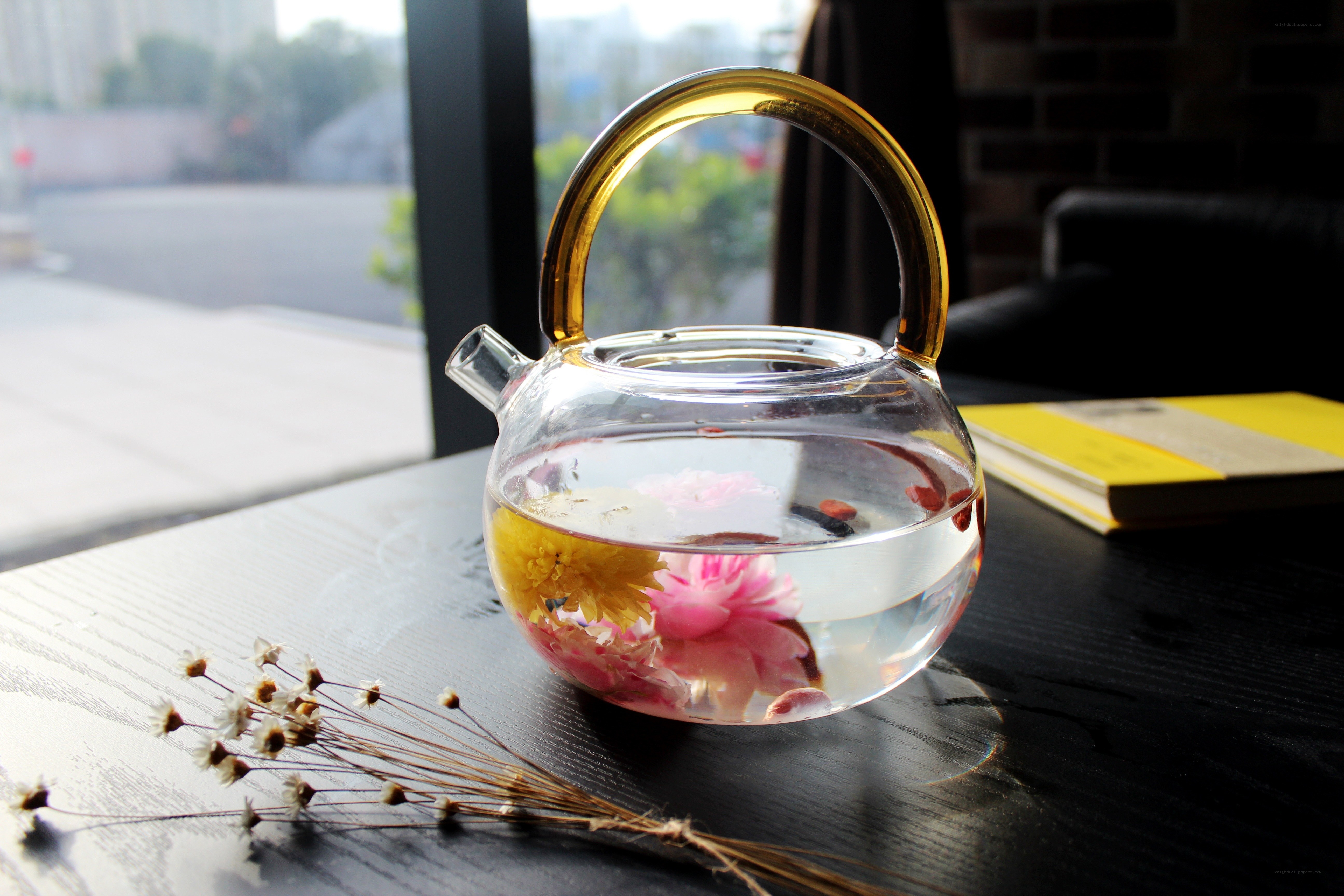 Flower tea in glass teapot