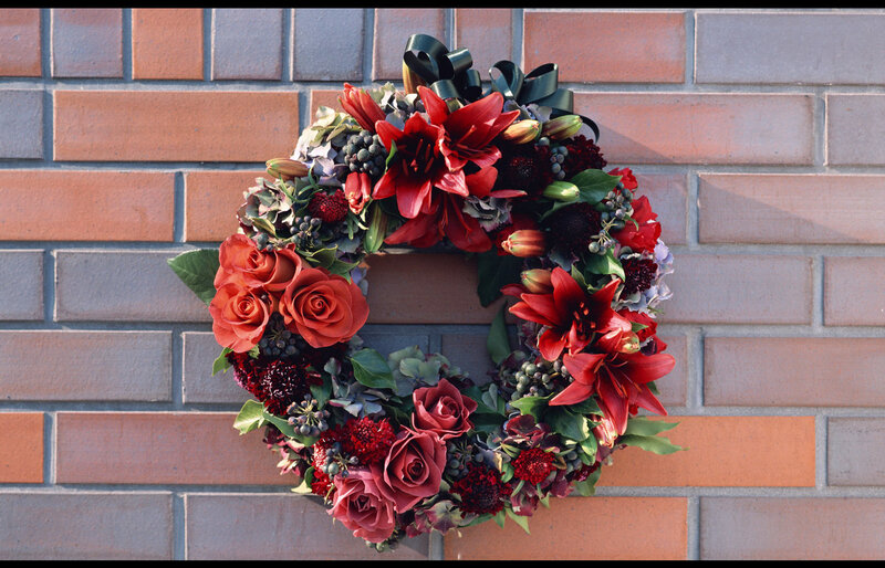 Flower Wreath on Brick Wall