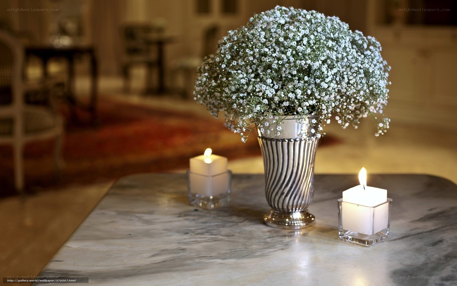 Flowers and candles on marble