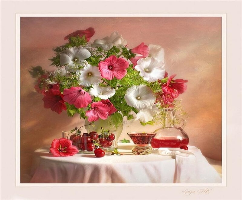 Flowers and cherries on a table