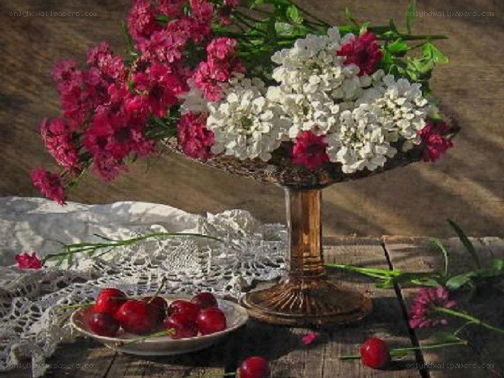 Flowers and cherries on a table