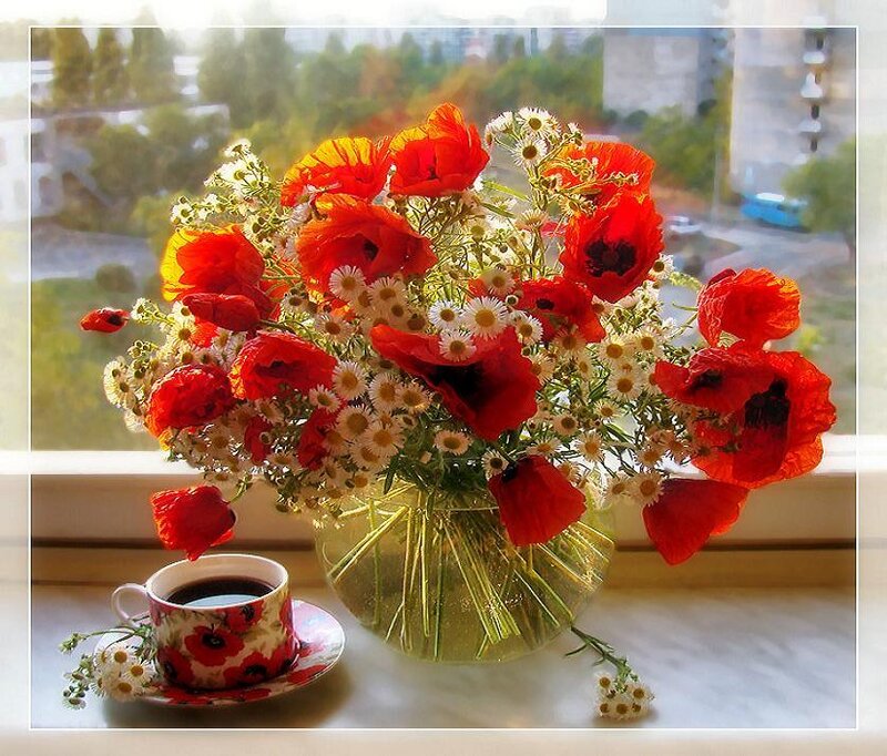 Flowers and coffee on a windowsill