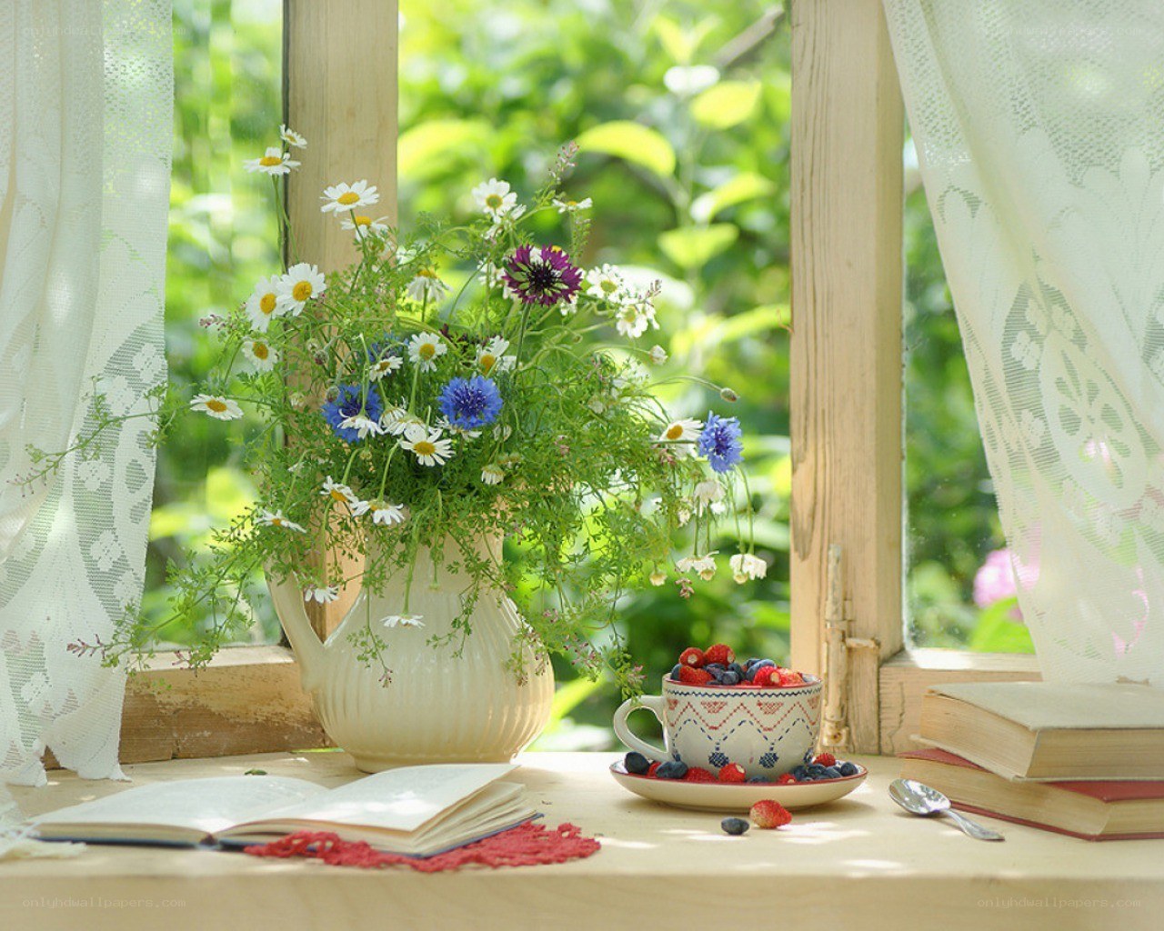 Flowers and fruit on a windowsill