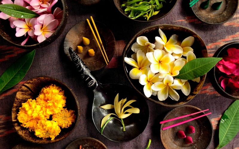 Flowers and incense in bowls