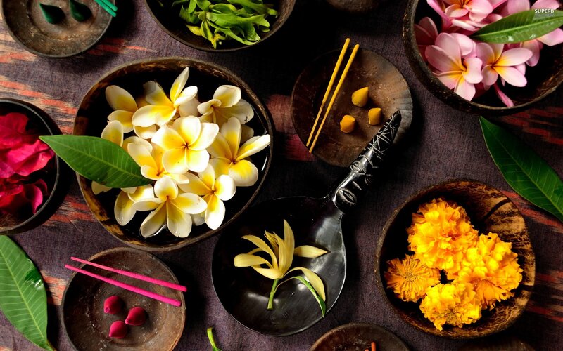 Flowers and incense in bowls