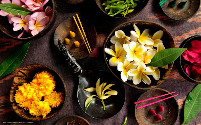 Flowers and incense in bowls
