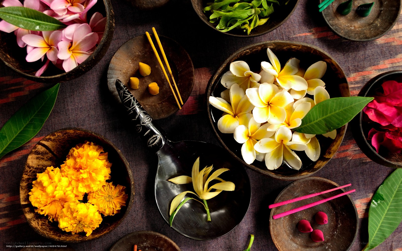 Flowers and incense in bowls