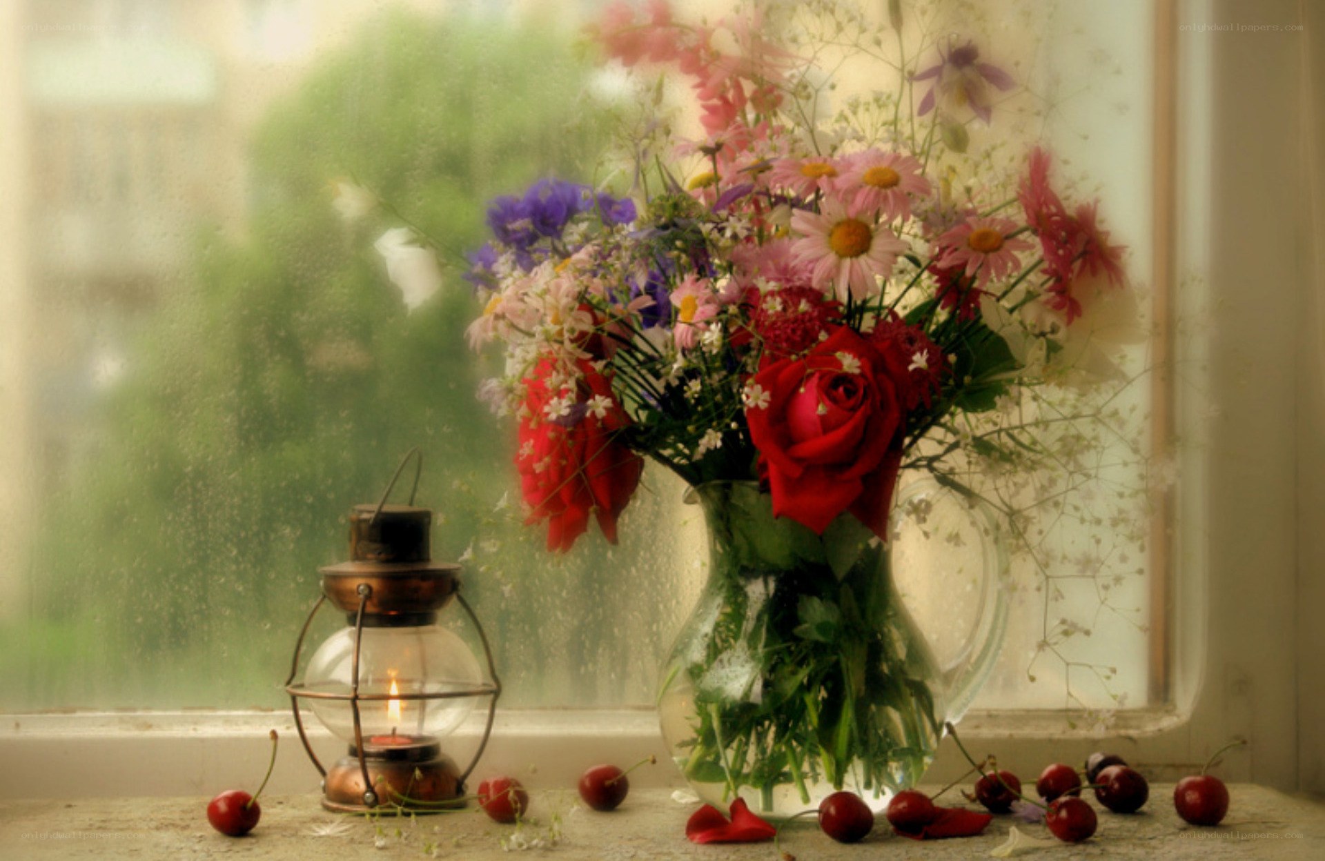 Flowers and lantern on a windowsill