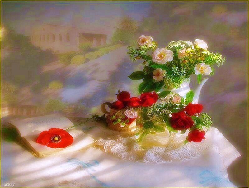 Flowers and open book on table