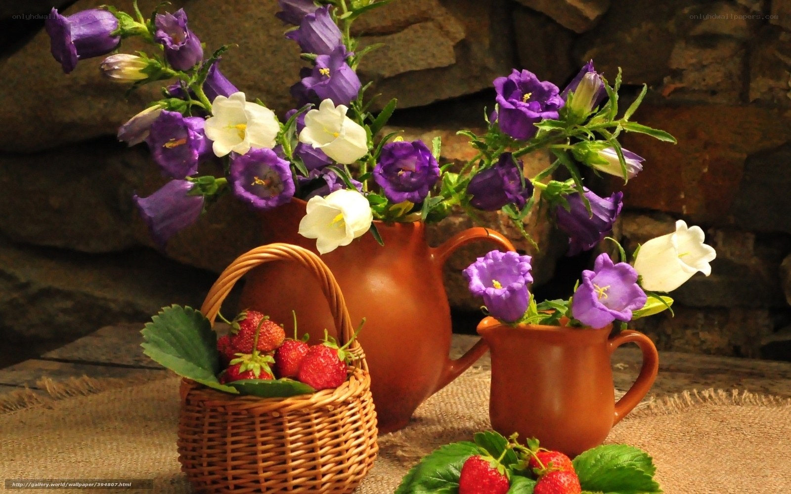 Flowers and strawberries in a basket