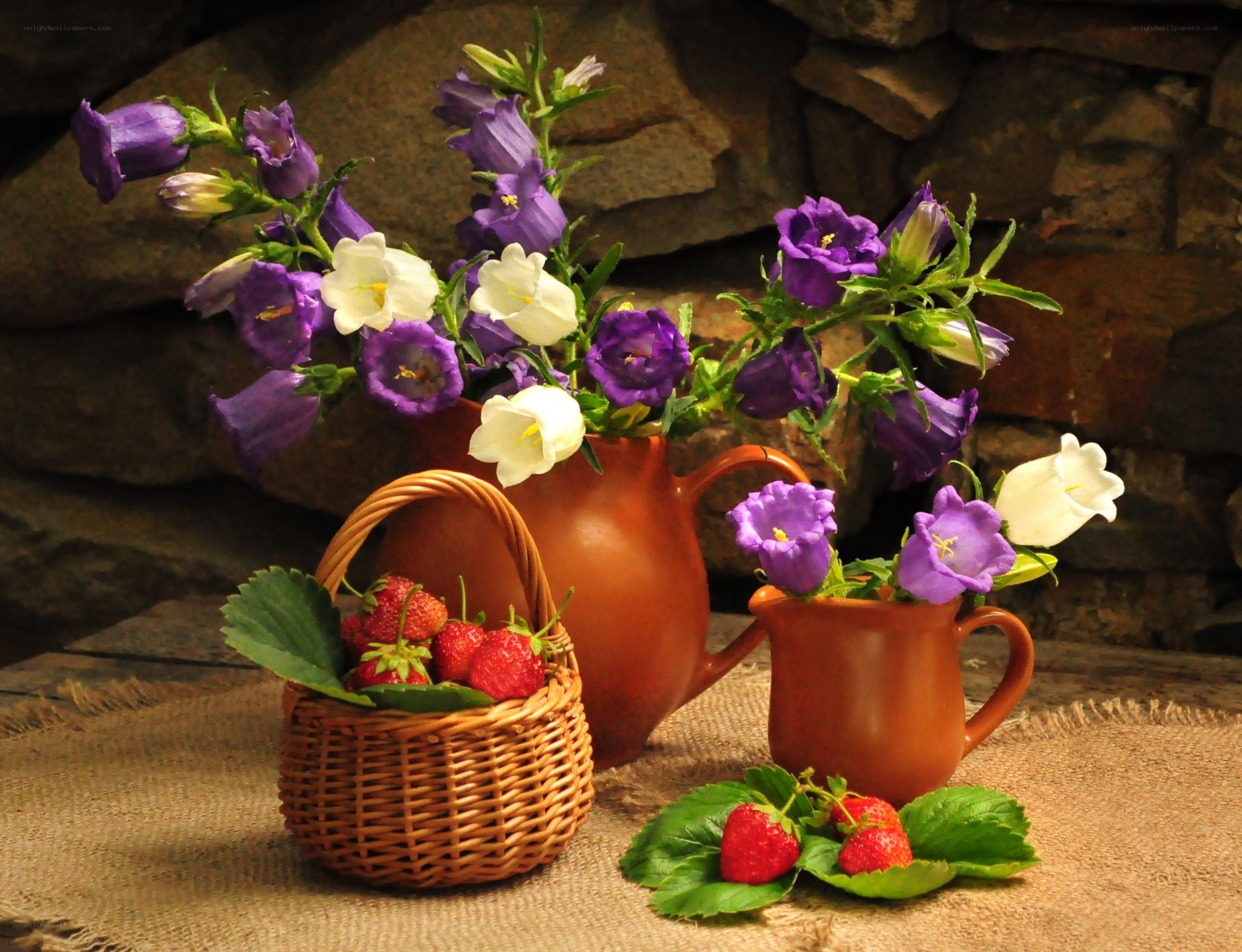 Flowers and strawberries in a basket