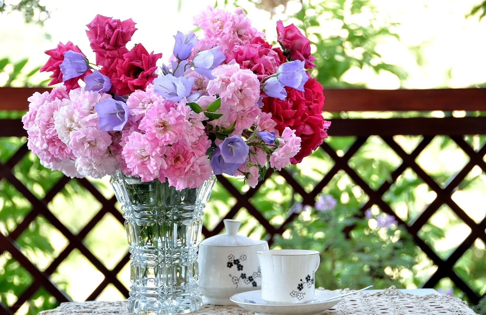 Flowers and tea on a balcony
