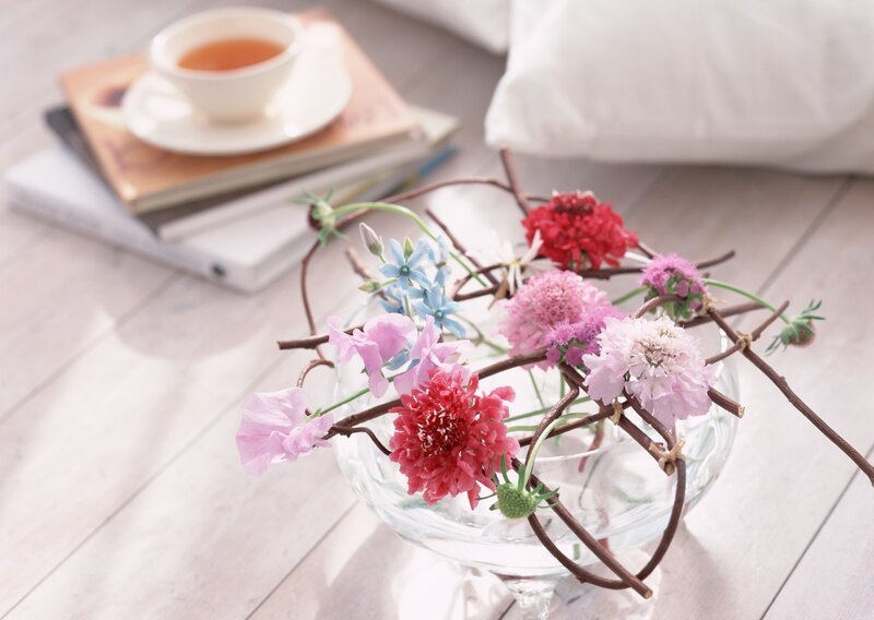 Flowers and tea on a wooden floor