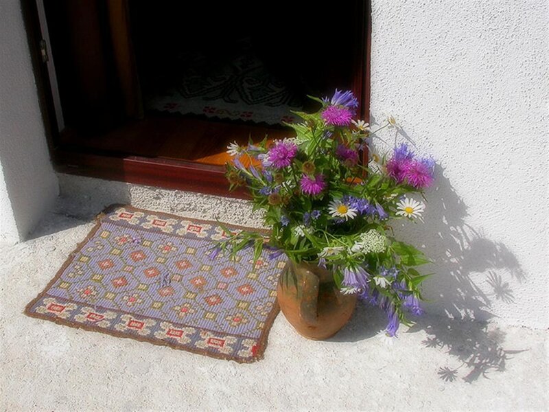 Flowers by the doorway