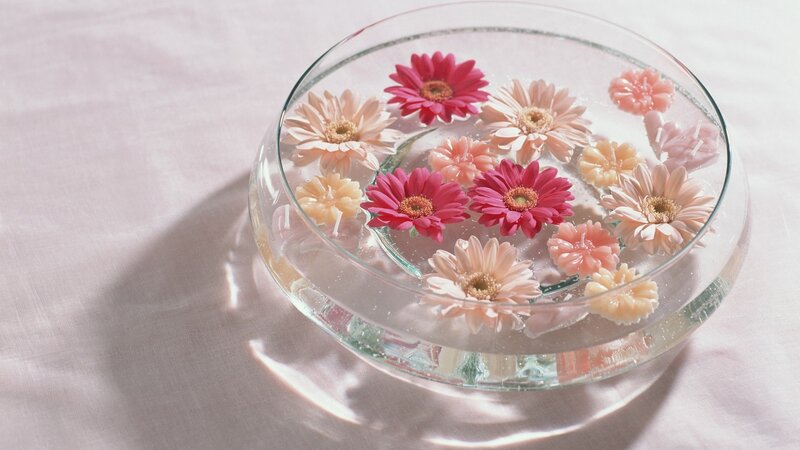 Flowers floating in a glass bowl