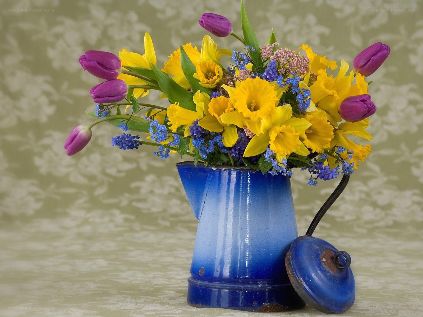 Flowers in a blue pitcher