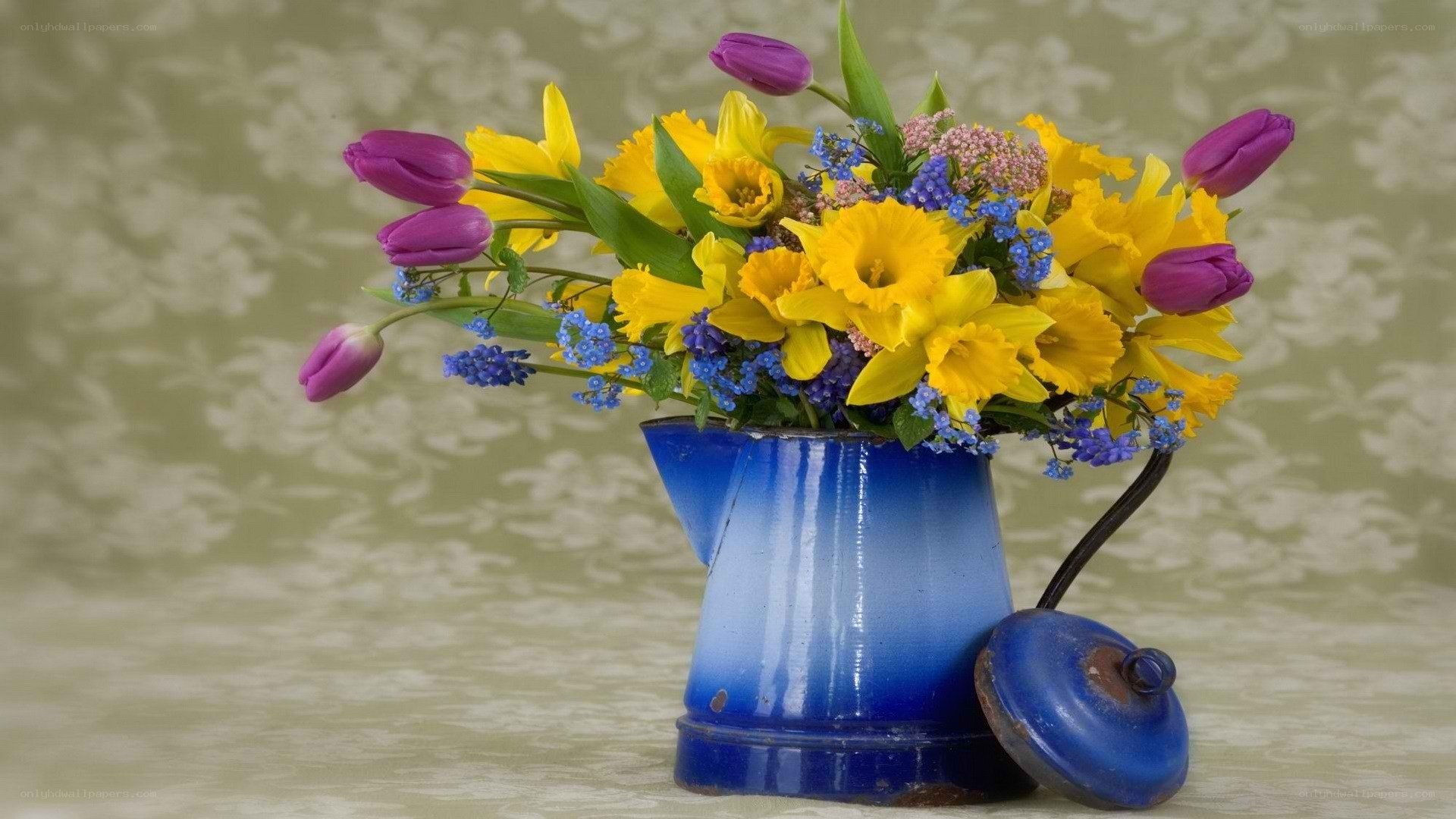 Flowers in a blue pitcher