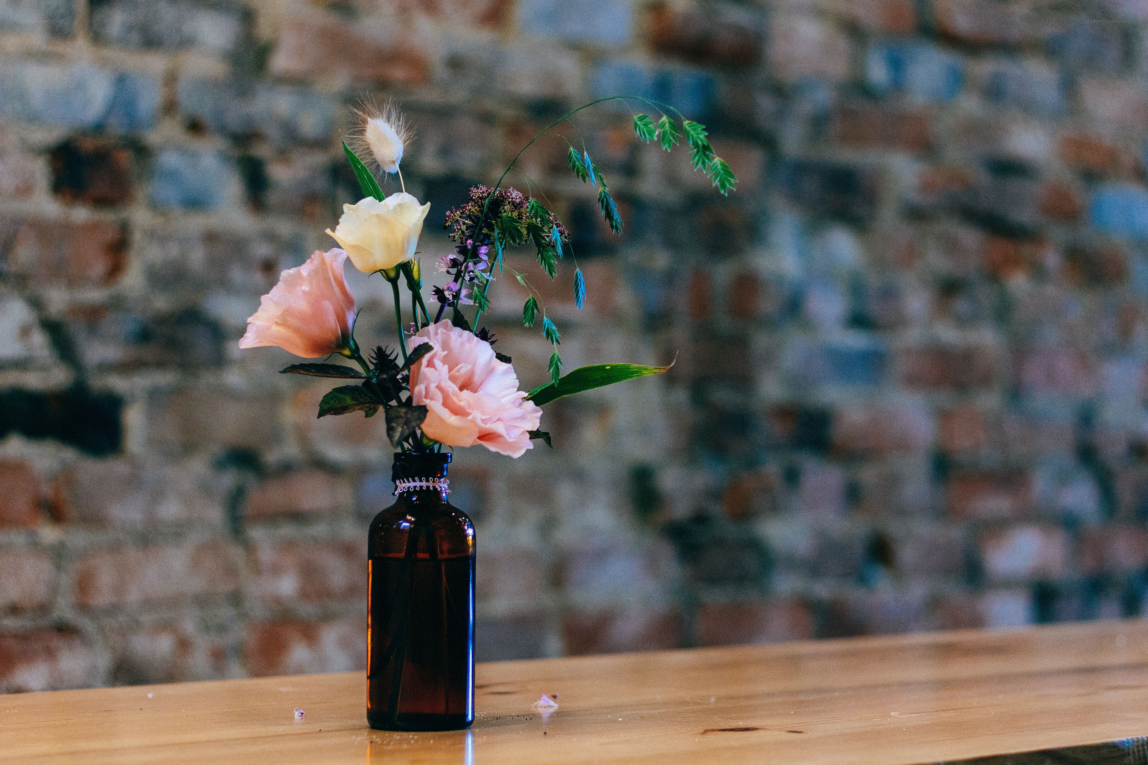 Flowers in a brown bottle