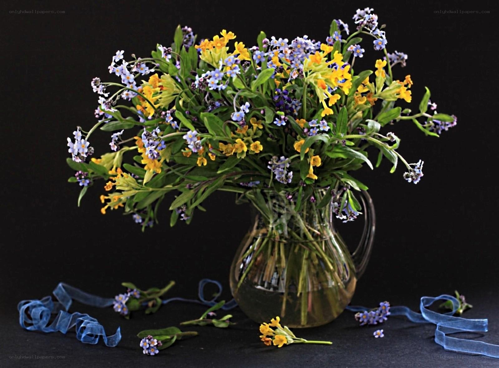 Flowers in a glass pitcher