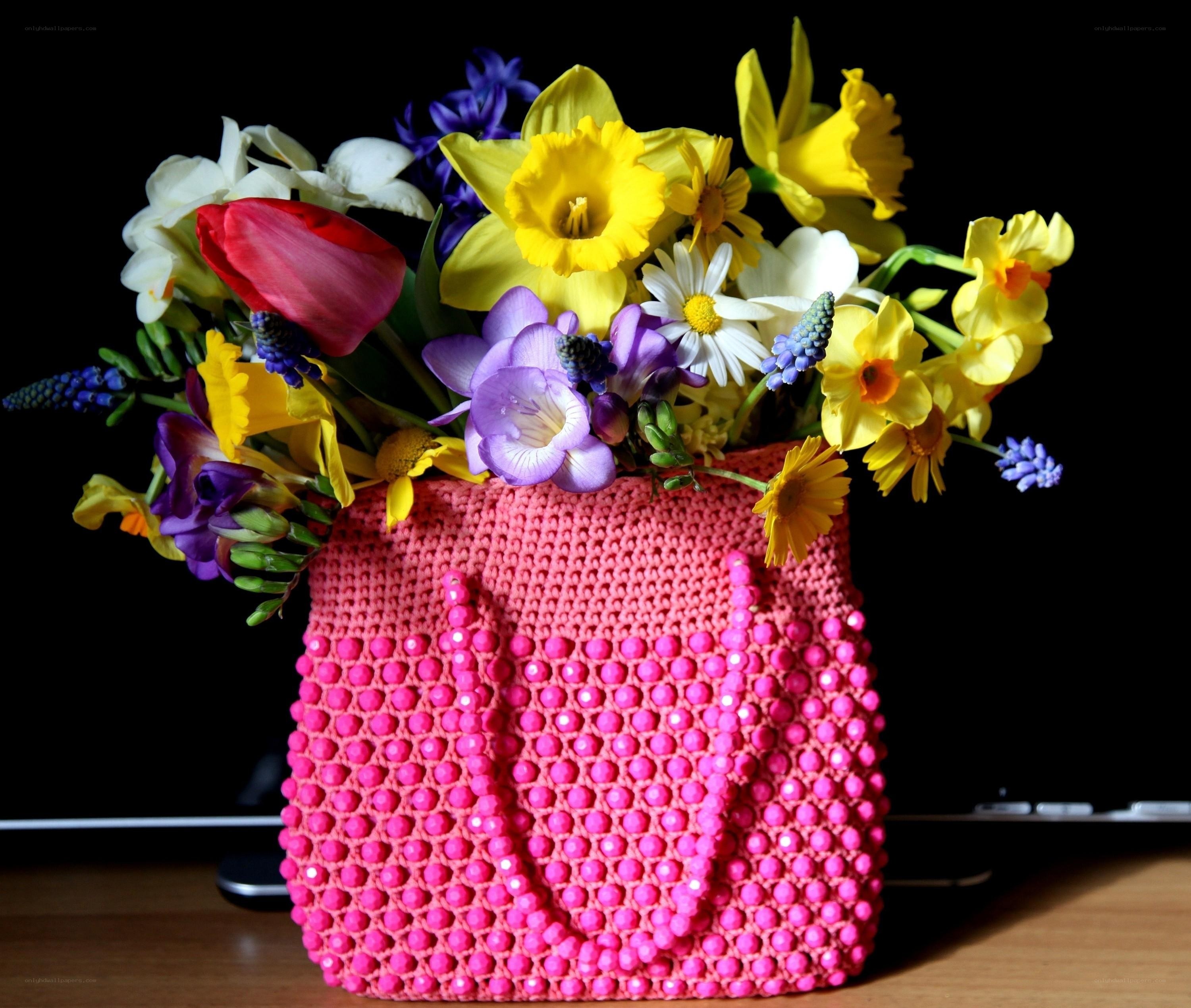Flowers in a pink crochet bag